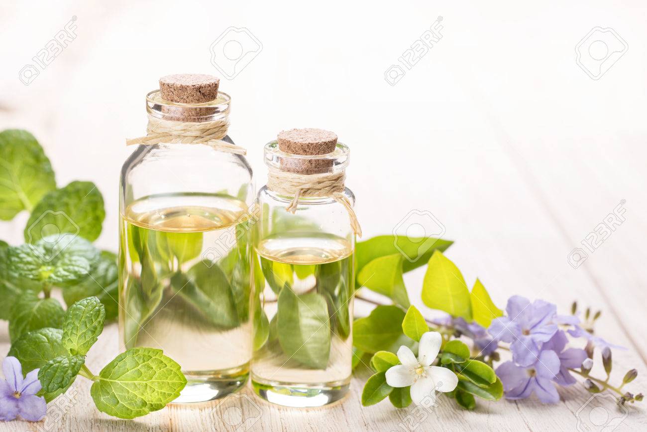 fresh mint essential oil and flowers - 52433349 fresh mint essential oil and flowers - 52433349