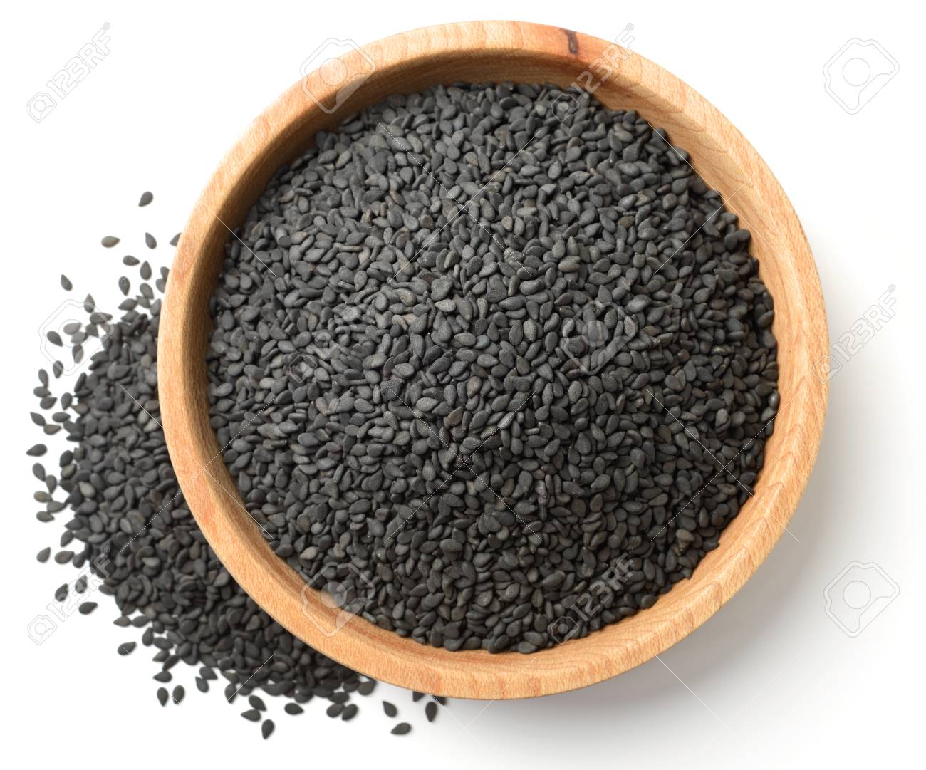 dried black sesame seeds in the wooden plate, isolated on white, top view - 98671718 dried black sesame seeds in the wooden plate, isolated on white, top view - 98671718