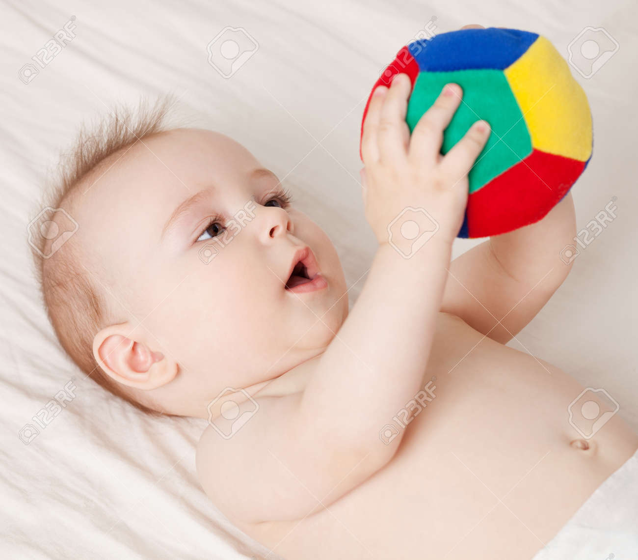 baby holding ball