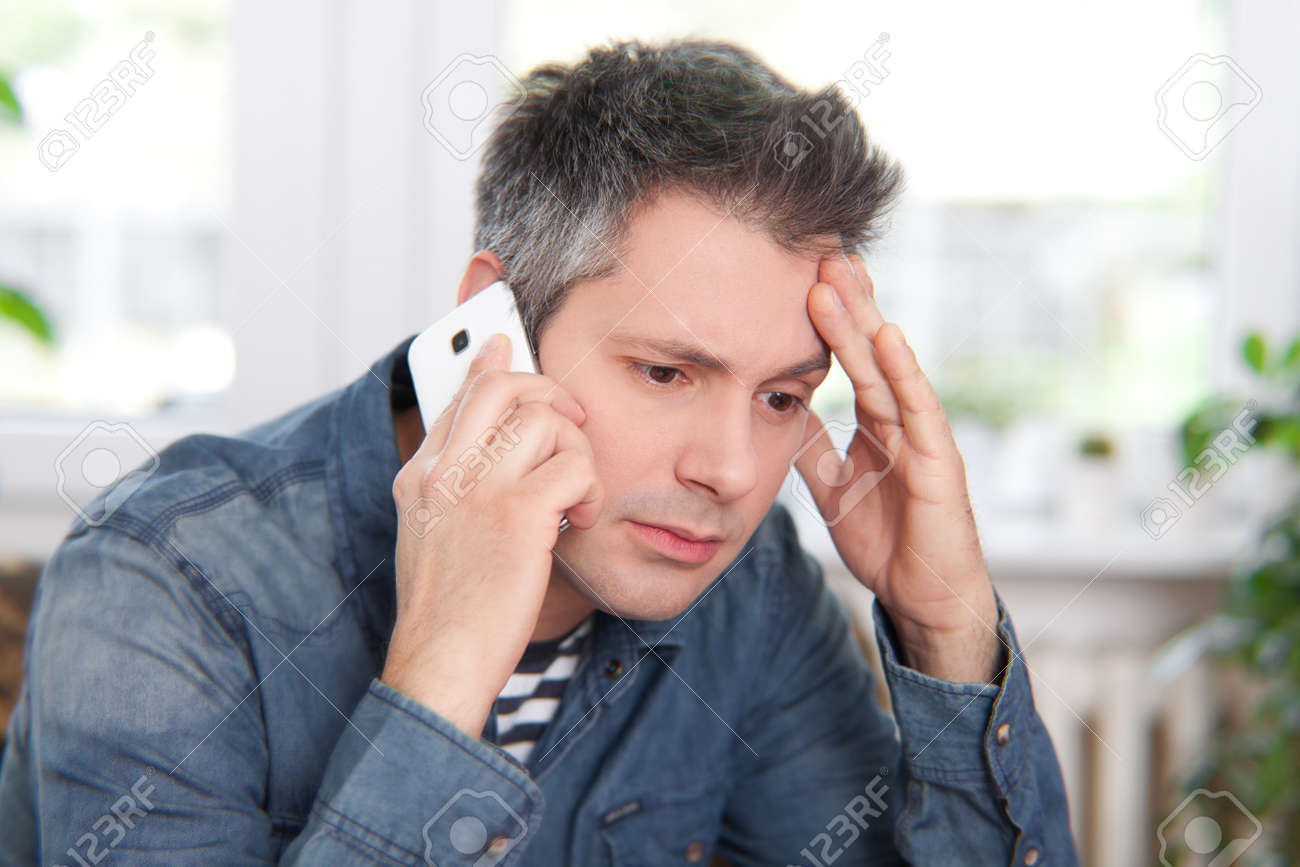 Man Getting Bad News On The Phone Stock Photo, Picture and ...