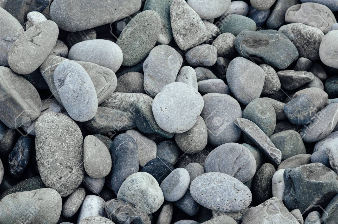 Gray stones close-up. Minimalistic beautiful background in gray tones. Pebble beach. - 103505345 Gray stones close-up. Minimalistic beautiful background in gray tones. Pebble beach. - 103505345
