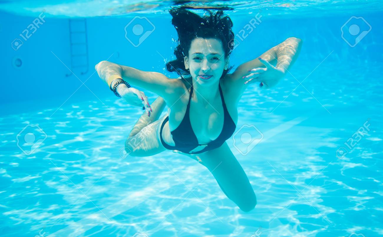 Underwater Woman Portrait Wearing Black Swimsuit In Swimming Pool,  Beautiful Turquoise Water. Close-up Stock Photo, Picture and Royalty Free  Image. Image 73367517., image size:1300x803
