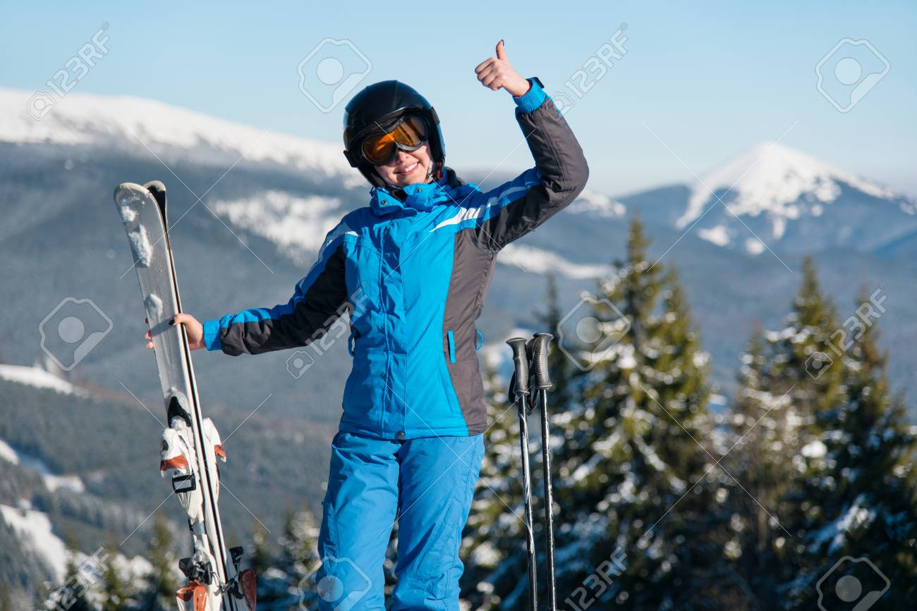 89417781-shot-of-a-happy-female-wearing-skiing-gear-smiling-showing-thumbs-up-posing-in-the-mountains-enjoyin.jpg