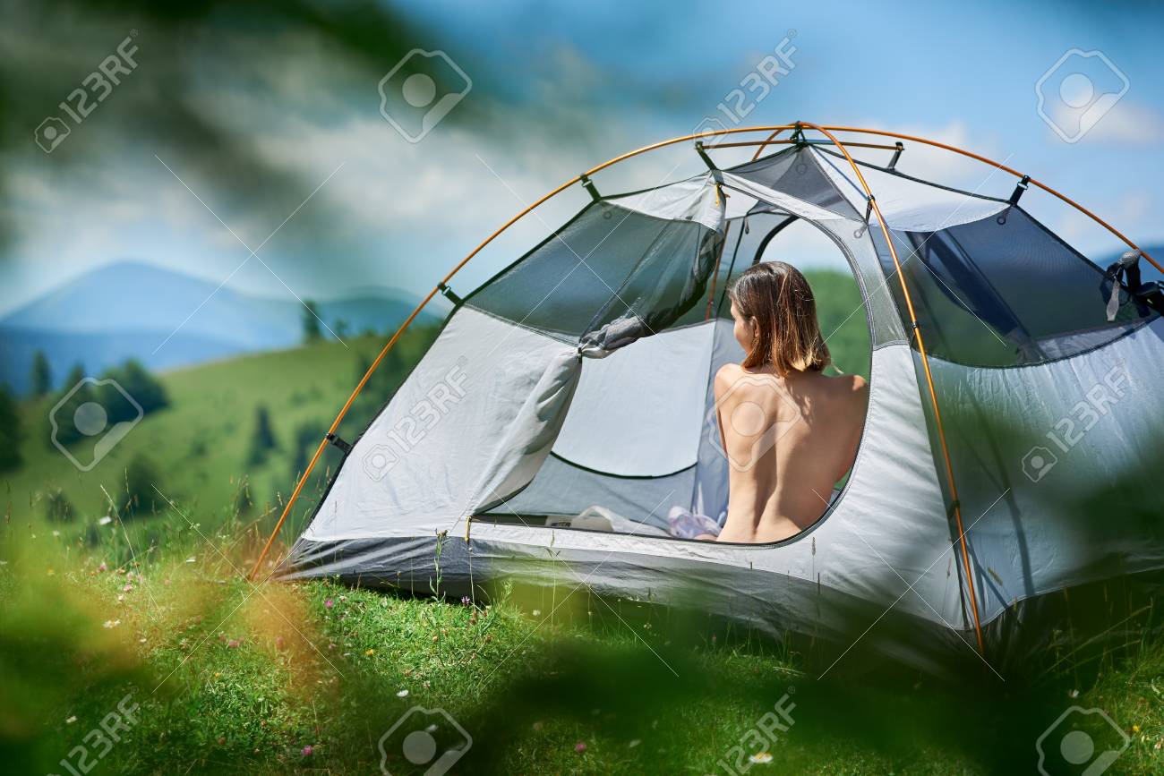 Back View Of Beautiful Naked Woman Traveller Sitting In Tent, Enjoying  Sunny Day In The Mountains. Camping Lifestyle Concept Stock Photo, Picture  And Royalty Free Image. Image 116485279.