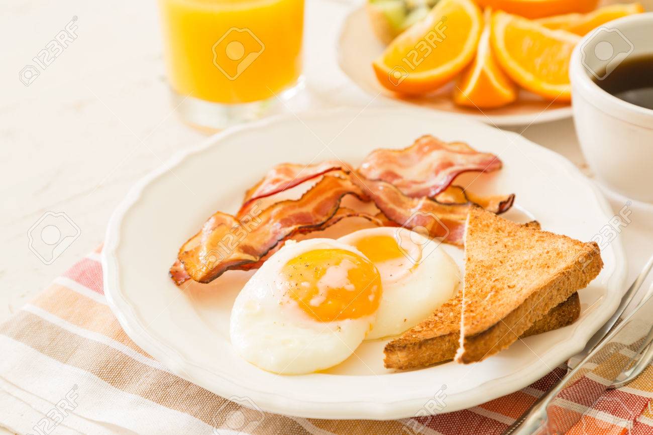 56078841-traditional-american-breakfast-white-background-copy-space.jpg