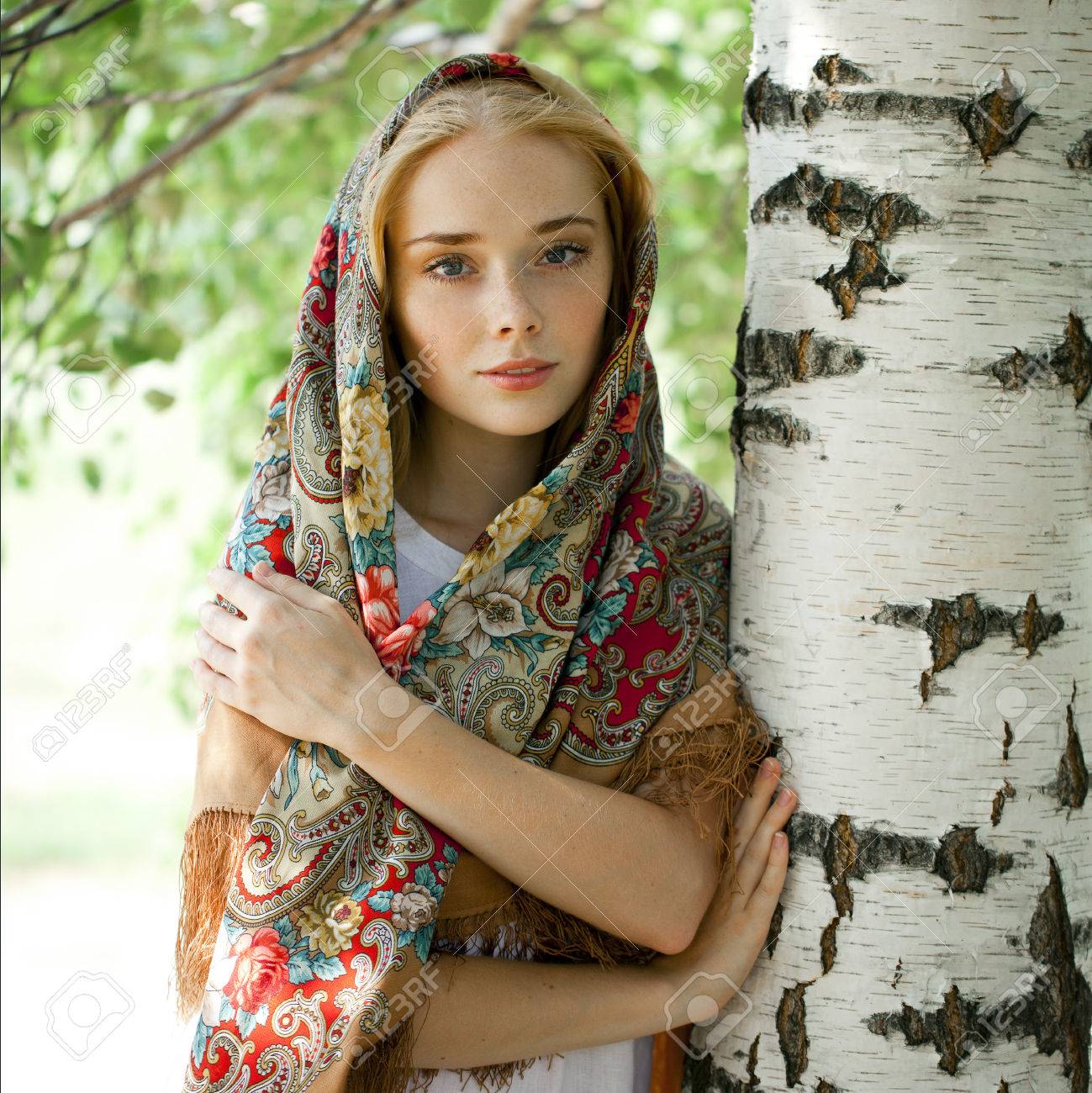 https://previews.123rf.com/images/andersonrise/andersonrise1408/andersonrise140800330/30623967-russian-beauty-woman-in-the-national-patterned-scarf.jpg