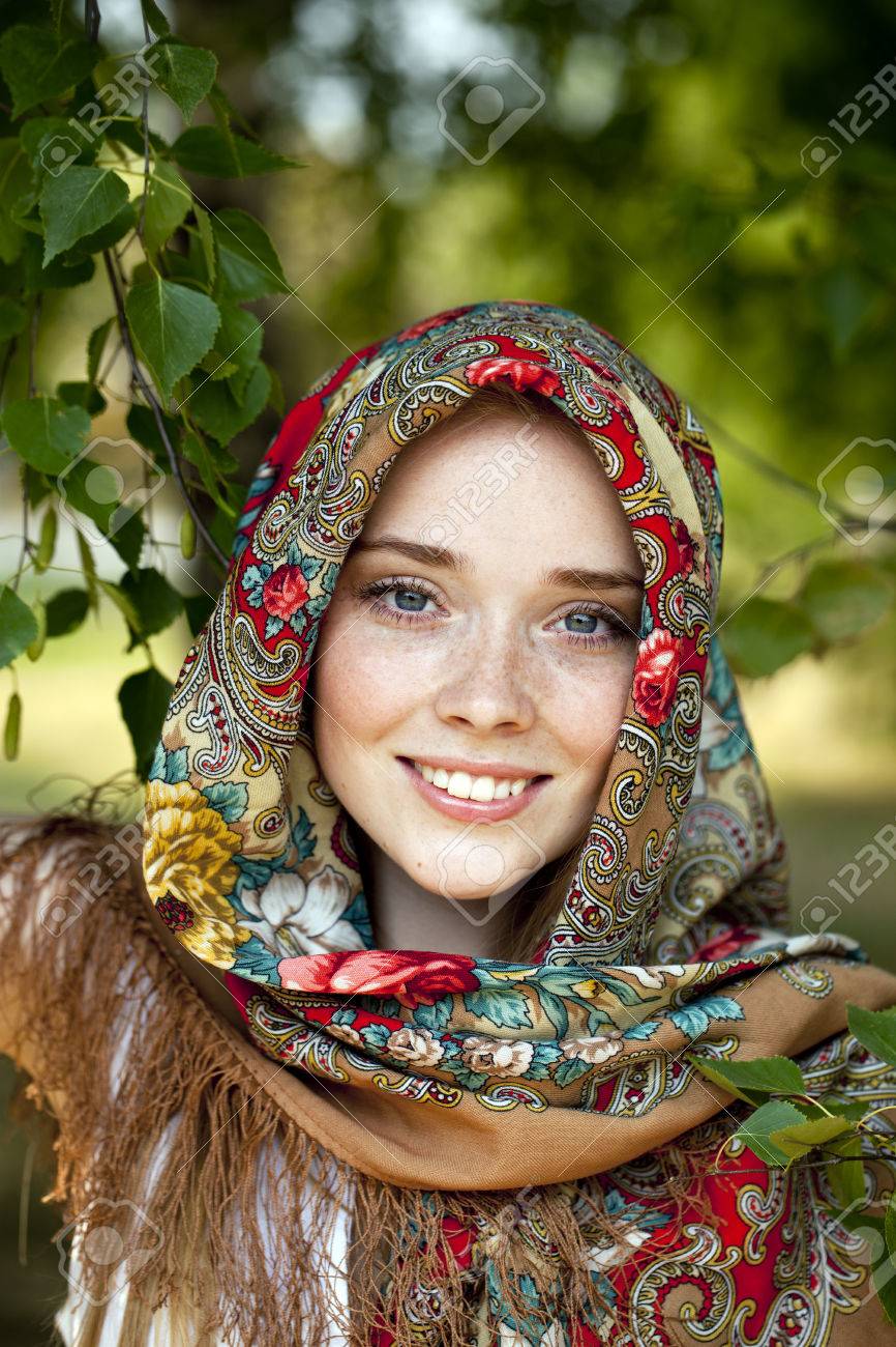 https://previews.123rf.com/images/andersonrise/andersonrise1408/andersonrise140800360/30623997-russian-beauty-woman-in-the-national-patterned-scarf.jpg