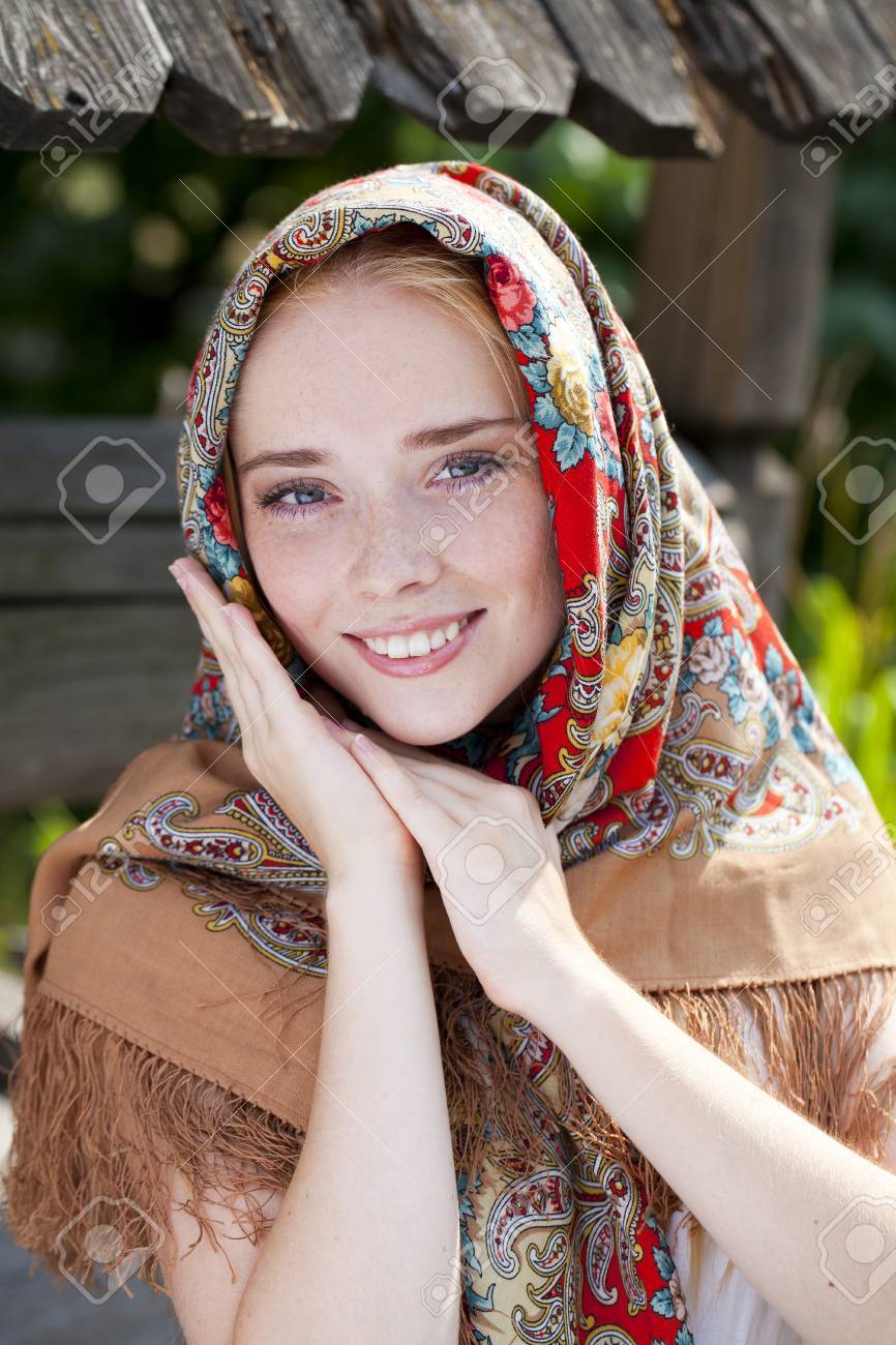 https://previews.123rf.com/images/andersonrise/andersonrise1503/andersonrise150301214/37574340-russian-beauty-woman-in-the-national-patterned-scarf.jpg