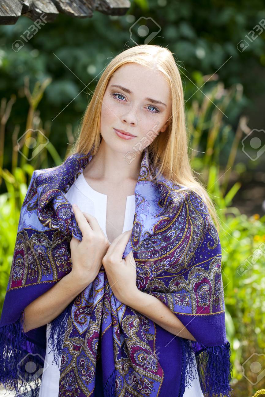 https://previews.123rf.com/images/andersonrise/andersonrise1503/andersonrise150301236/37574405-russian-beauty-woman-in-the-national-patterned-scarf.jpg