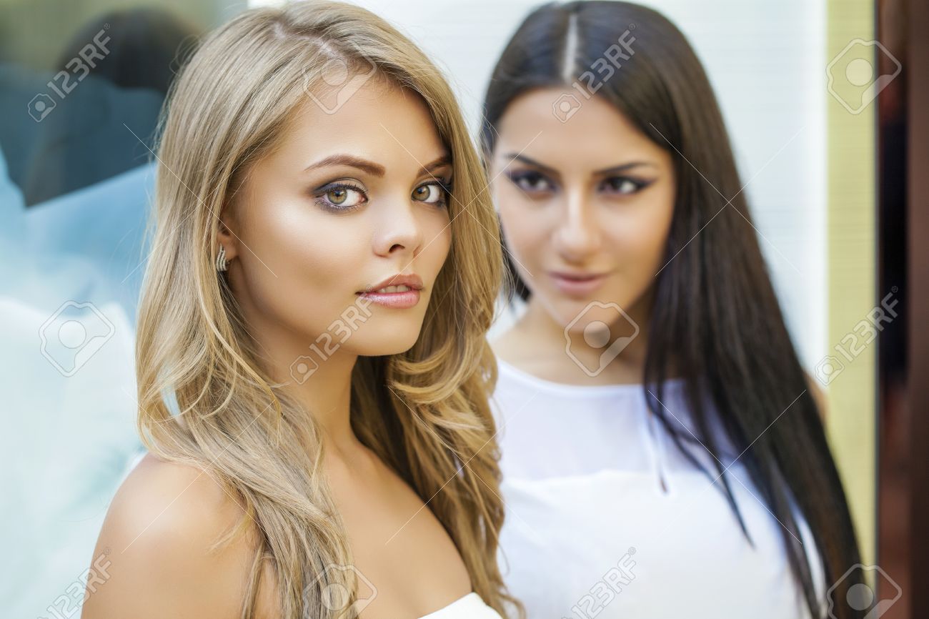 Glamorous Portrait Of Two Young Beautiful Women Blonde And Brunette Stock Photo Picture And Royalty Free Image Image 46282691