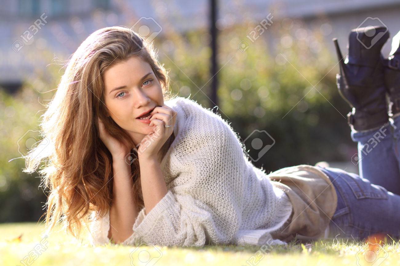 Attractive Sweet Blonde Girl Posing Lying On The Lawn In Autumn Park Stock Photo 77188172 Attractive Sweet Blonde Girl Posing Lying On The Lawn In Autumn Park Stock Photo 77188172
