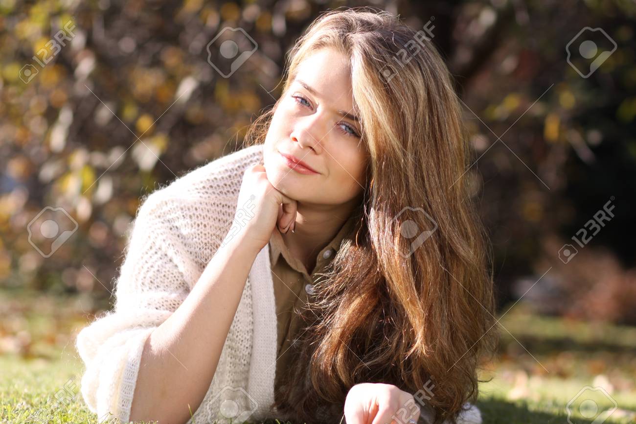 Attractive Sweet Blonde Girl Posing Lying On The Lawn In Autumn Park Stock Photo 77188177 Attractive Sweet Blonde Girl Posing Lying On The Lawn In Autumn Park Stock Photo 77188177