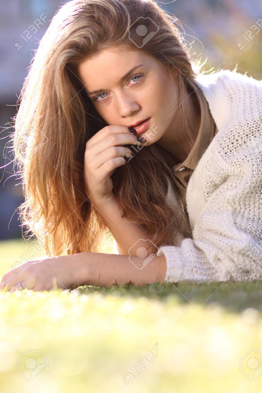 Attractive Sweet Blonde Girl Posing Lying On The Lawn In Autumn Park Stock Photo 77188210 Attractive Sweet Blonde Girl Posing Lying On The Lawn In Autumn Park Stock Photo 77188210