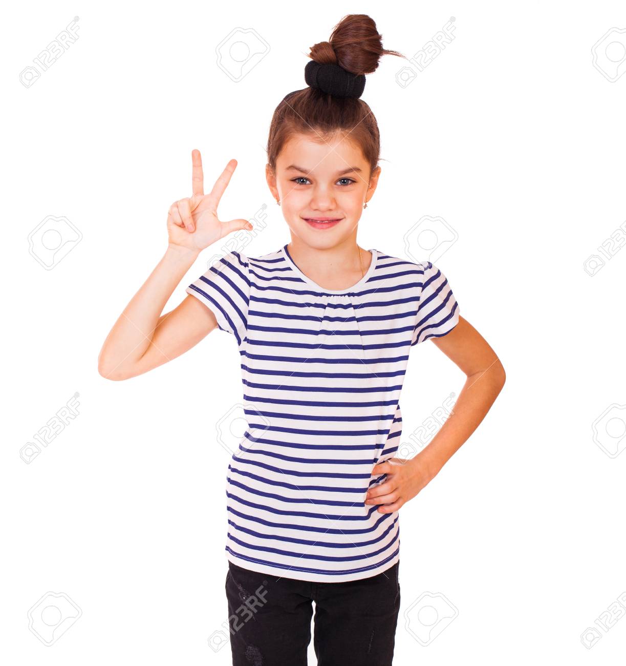 seven year old little girl shows three fingers on her hand stock