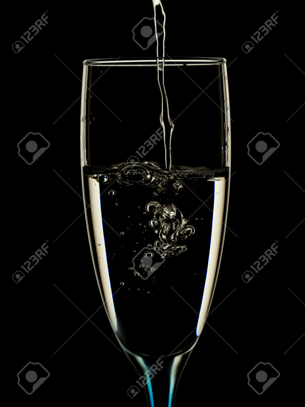 Elegant picture in glasses is poured with clean water on a black background - 130212142 Elegant picture in glasses is poured with clean water on a black background - 130212142