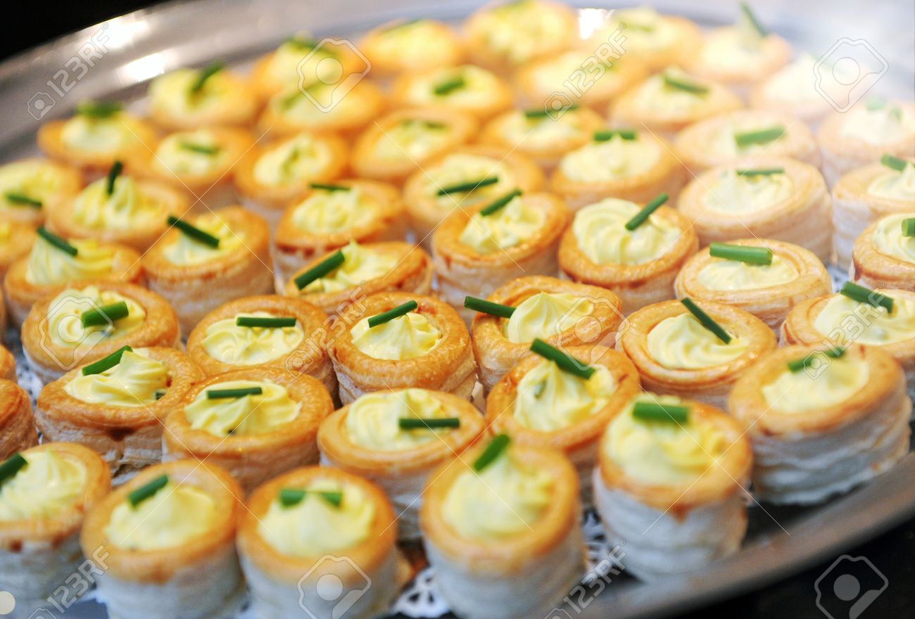 Tray Of Savory Vol Au Vent Appetizers With Crisp Gplden Pastry Cases Filled With A Creamy Filling Topped With Chives On A Buffet Table Stock Photo Picture And Royalty Free Image Image