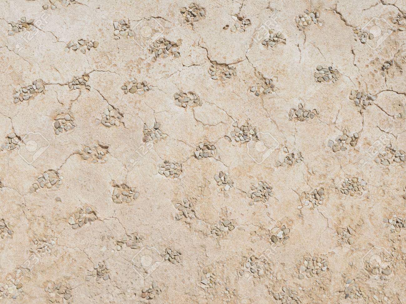 decorative wall with a rough surface dirty dented and many spots