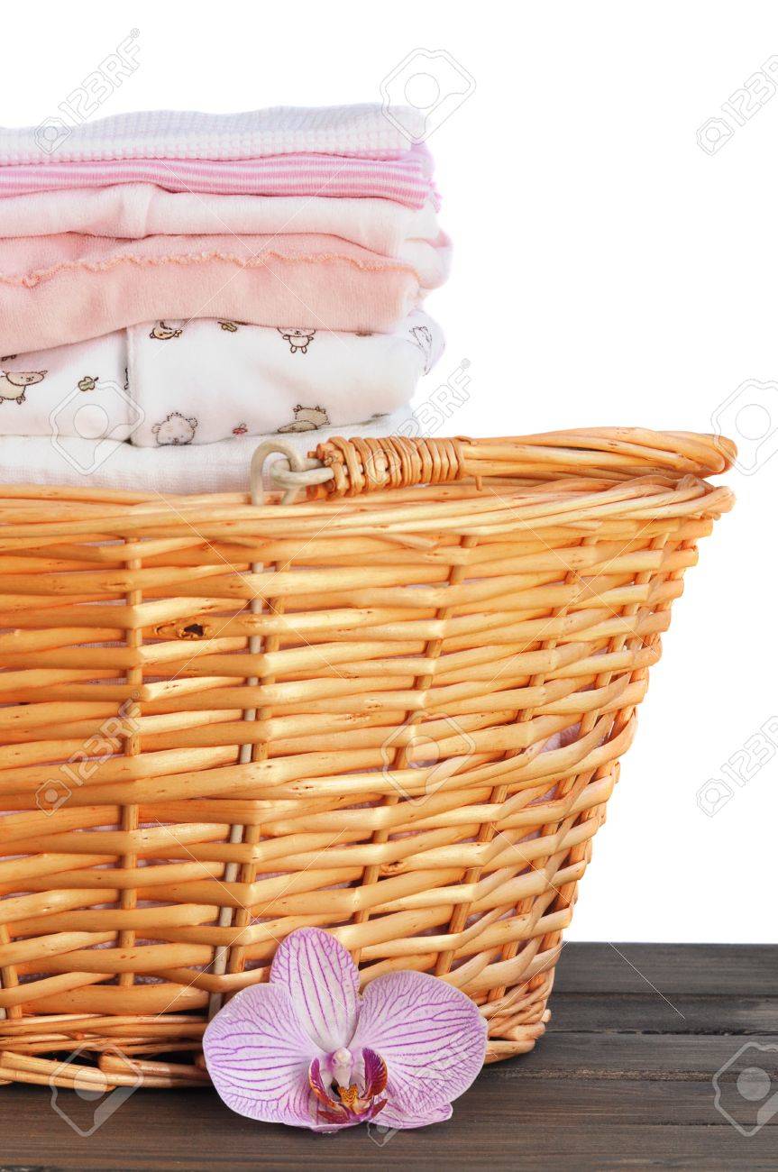 Laundry Basket Full Of Ironed Pink Baby Clothes Isolated On Stock