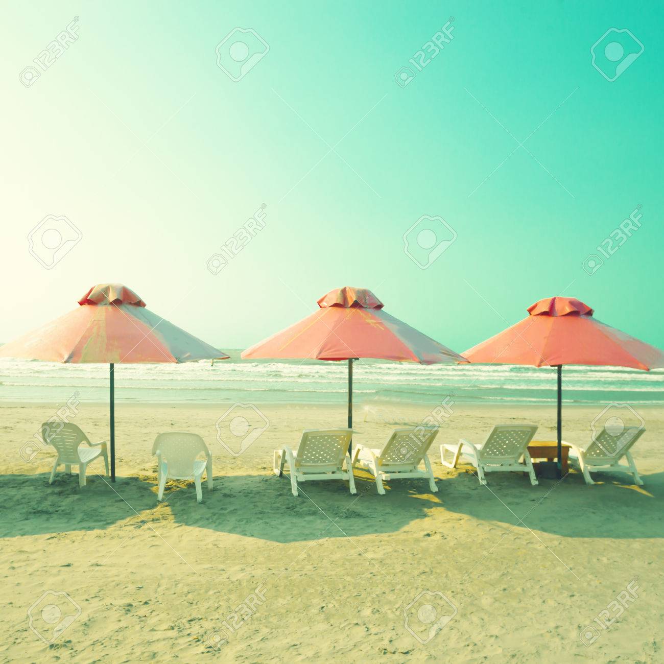 Vintage Summer Beach With Pink Umbrellas Stock Photo Picture And Royalty Free Image Image 30705101