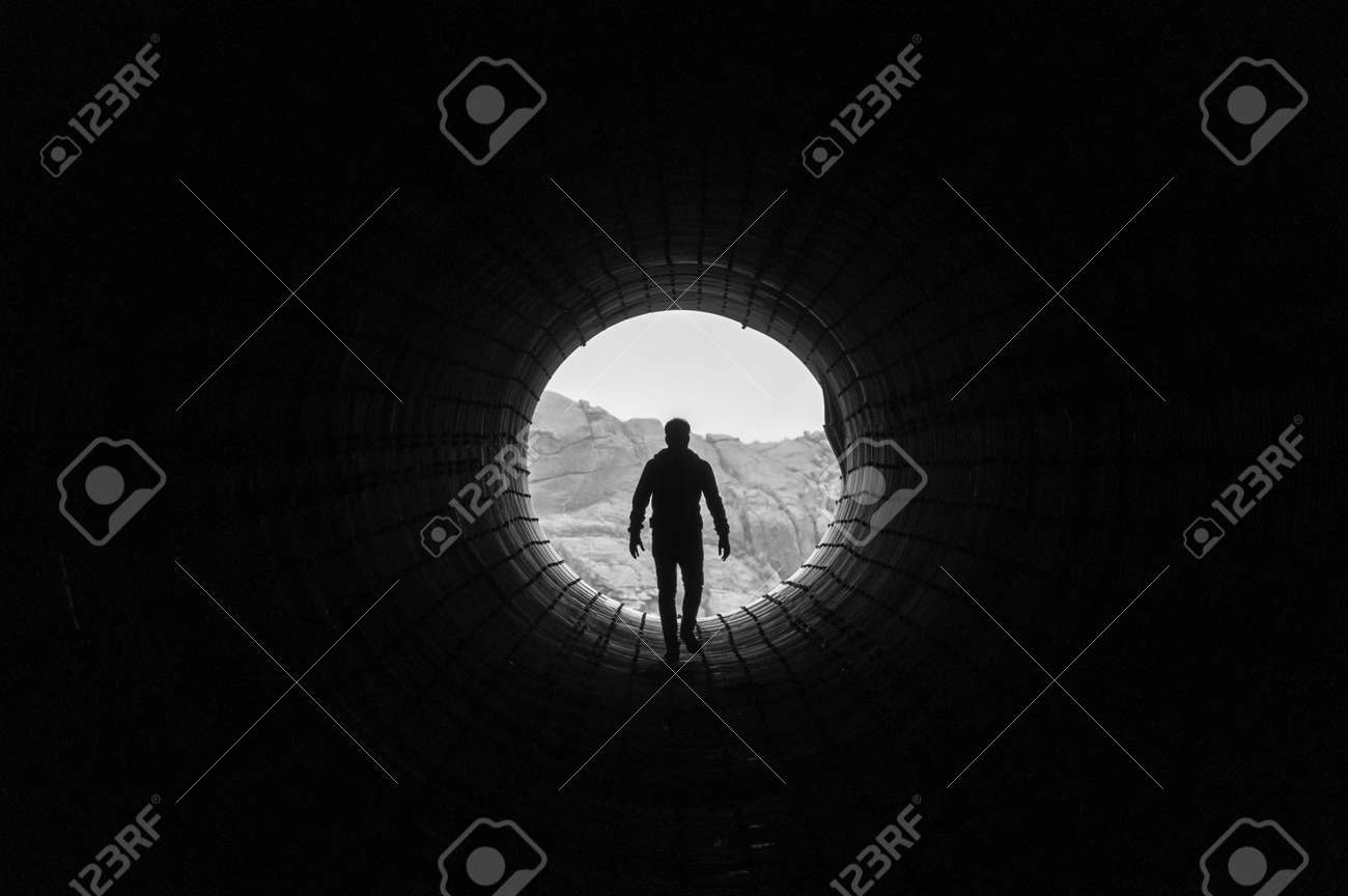 Silhouette Of A Man Walking To The Light At The End Of A Big Stock Photo Picture And Royalty Free Image Image Silhouette Of A Man Walking To The Light At The End Of A Big Stock Photo Picture And Royalty Free Image Image