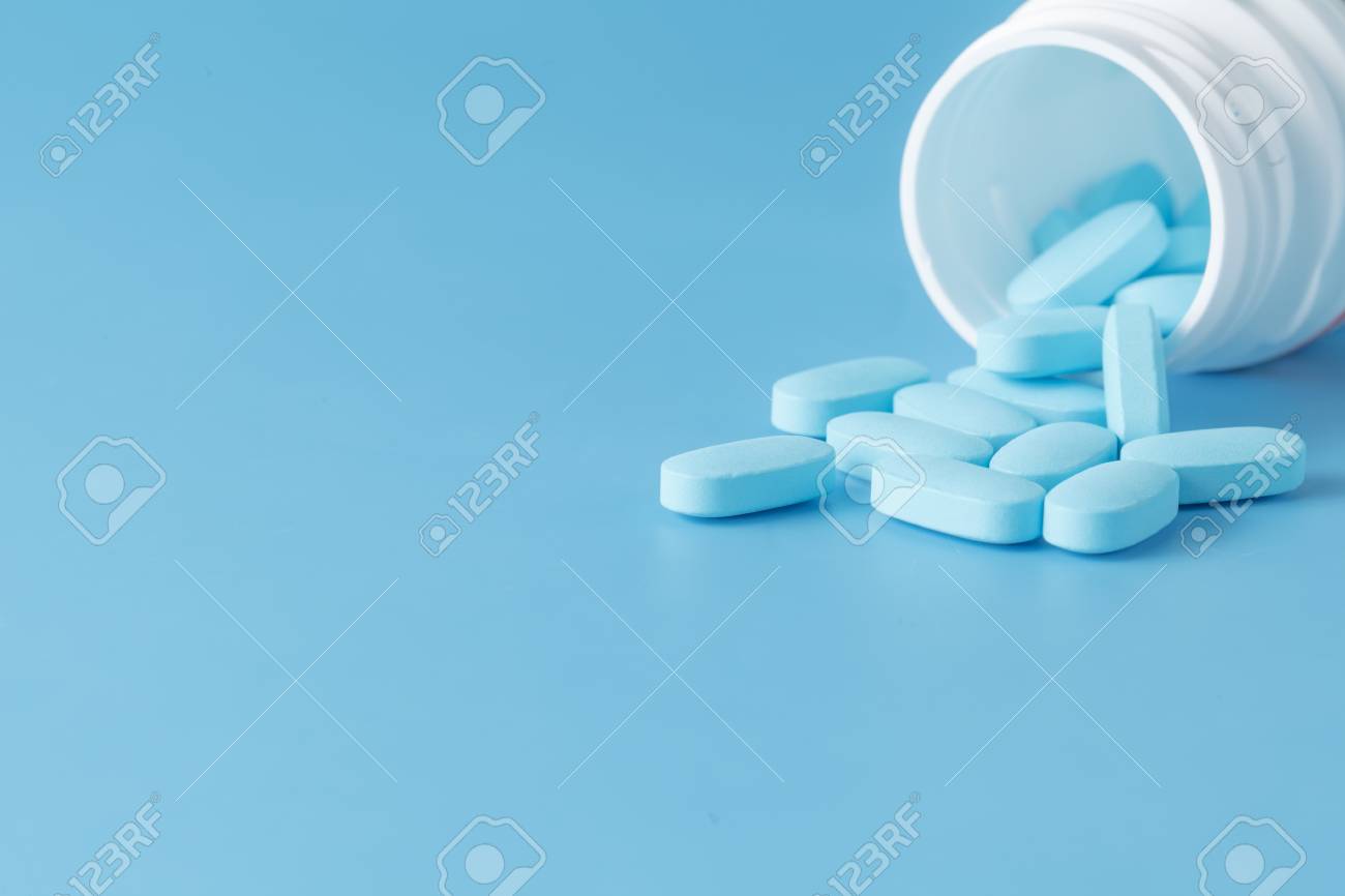 Download Blue Pills An Pill Bottle On Blue Background Stock Photo Picture And Royalty Free Image Image 51263037 Yellowimages Mockups
