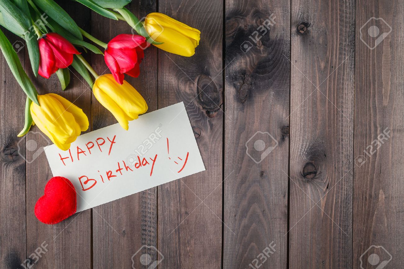 Happy Birthday Message And Tulips Flower On Table Stock Photo Picture And Royalty Free Image Image