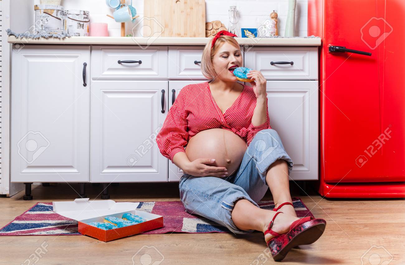 Pregnancy And Unhealthy Eating Concept Pregnant Woman Holds