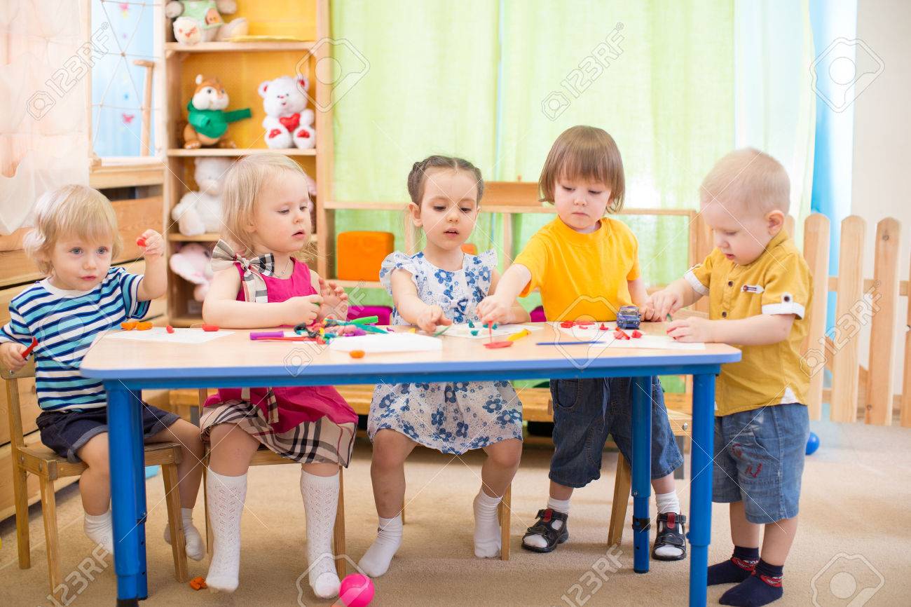 kids group learning arts and crafts in day care centre playroom day care centre pictures