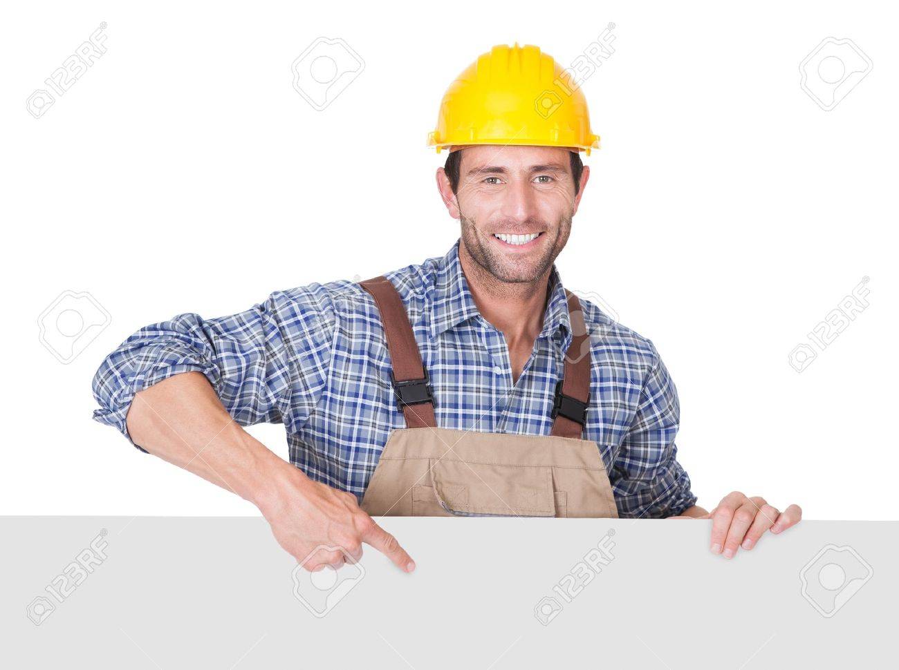 portrait of happy construction worker presenting empty banner