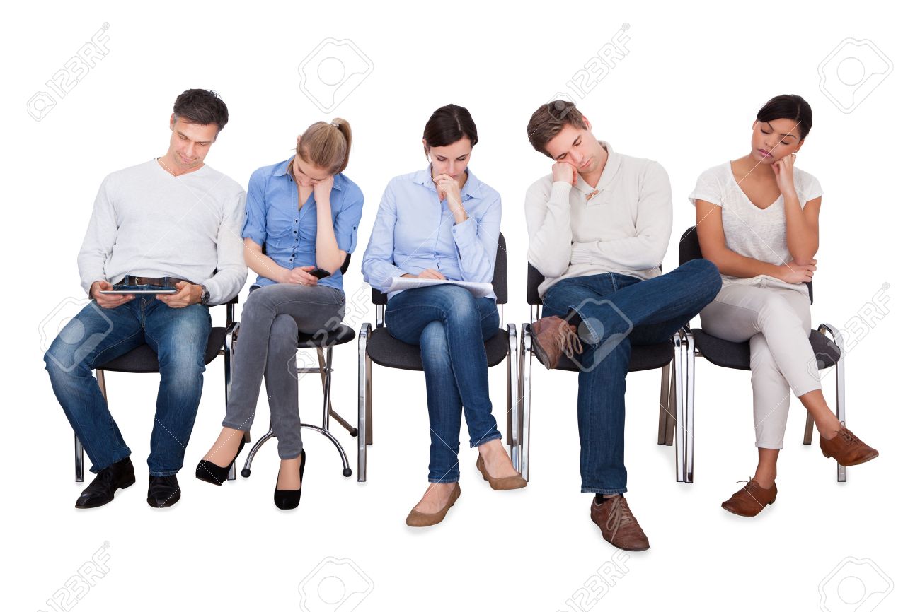 Full length of bored businesspeople sitting on chairs against white background - 33379903 Full length of bored businesspeople sitting on chairs against white background - 33379903