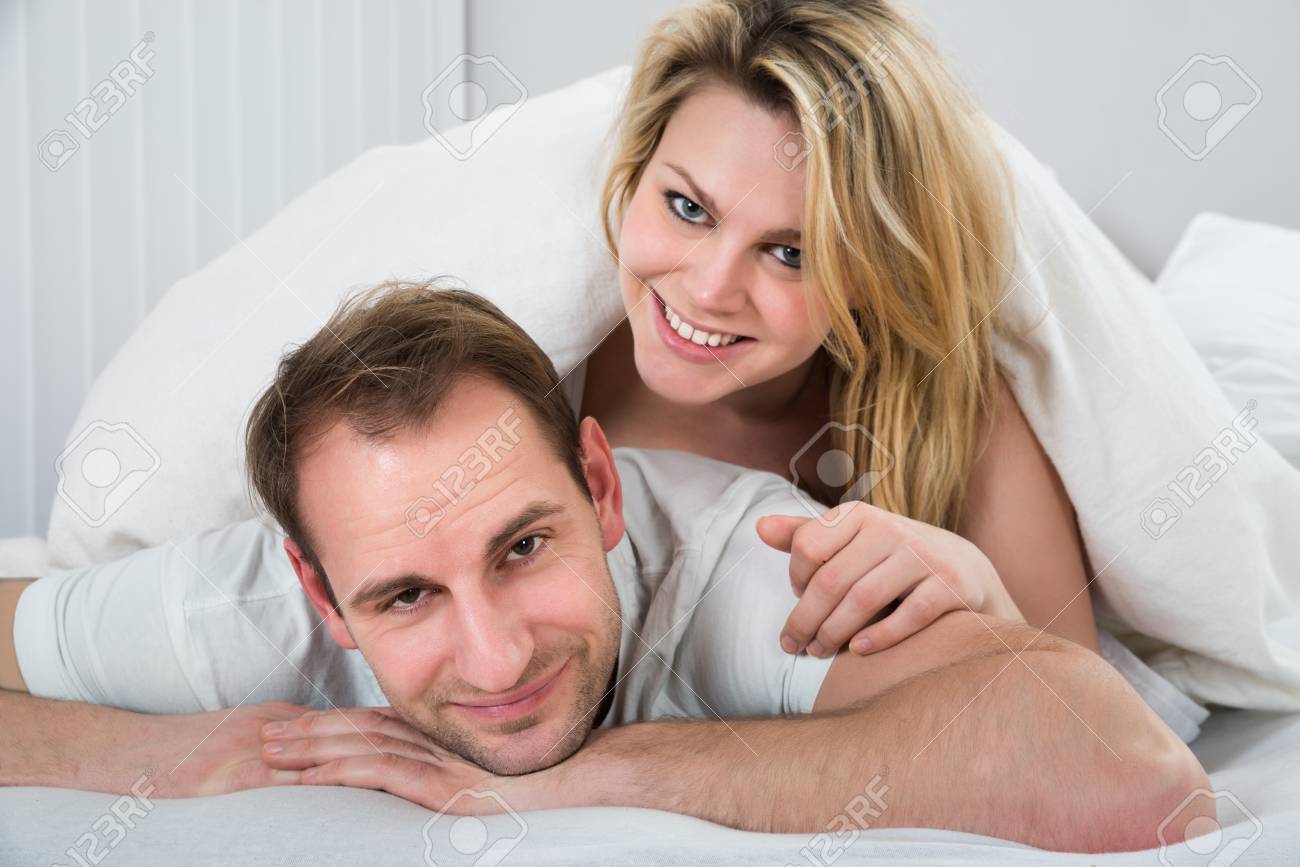 https://previews.123rf.com/images/andreypopov/andreypopov1504/andreypopov150400304/38811869-portrait-of-happy-woman-lying-on-back-of-man.jpg