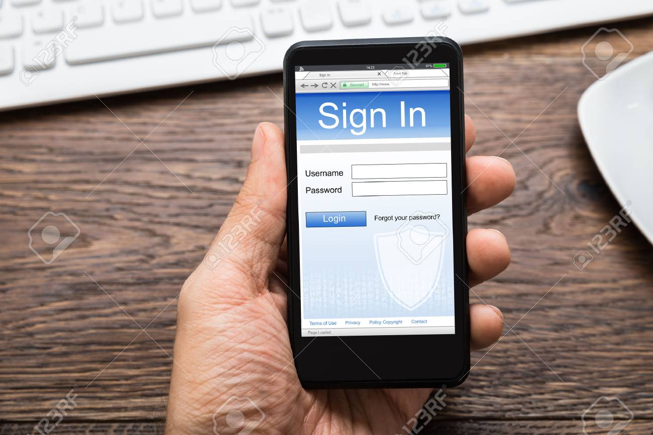 Close Up Of Person Hands With Mobile Phone Showing Signing App