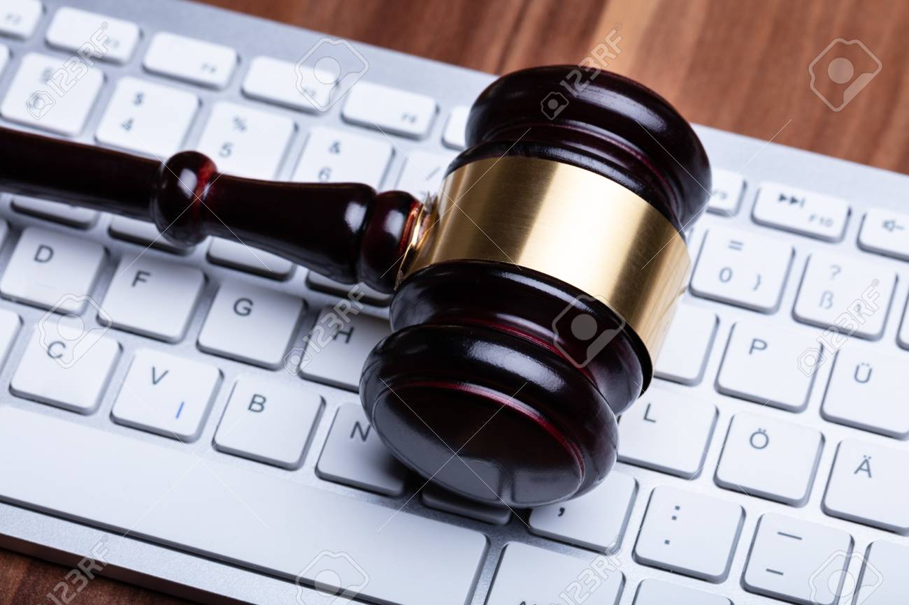 Close-up Photo Of Wooden Gavel On Keyboard - 120158529 Close-up Photo Of Wooden Gavel On Keyboard - 120158529