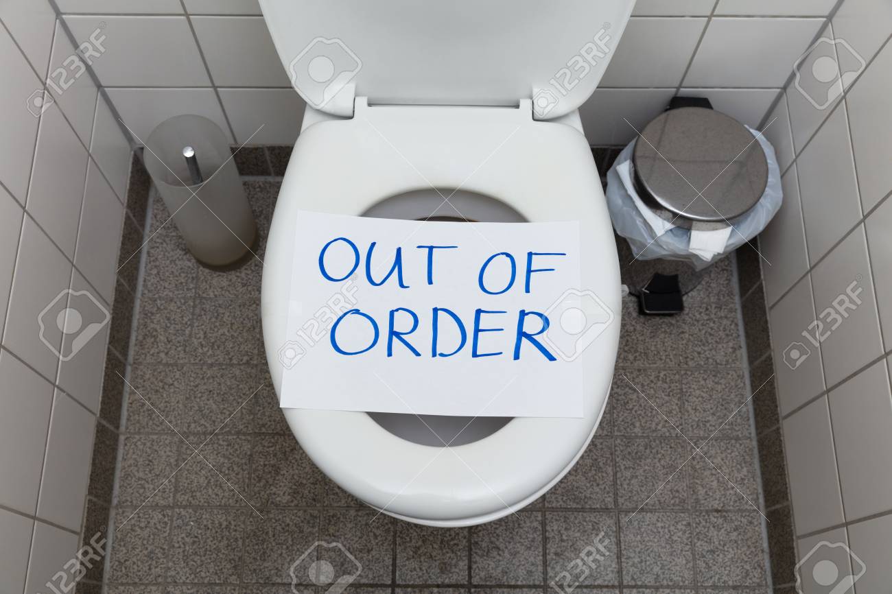 Written Text Out Of Order Message On Paper Over Toilet Bowl In Bathroom - 121138920 Written Text Out Of Order Message On Paper Over Toilet Bowl In Bathroom - 121138920