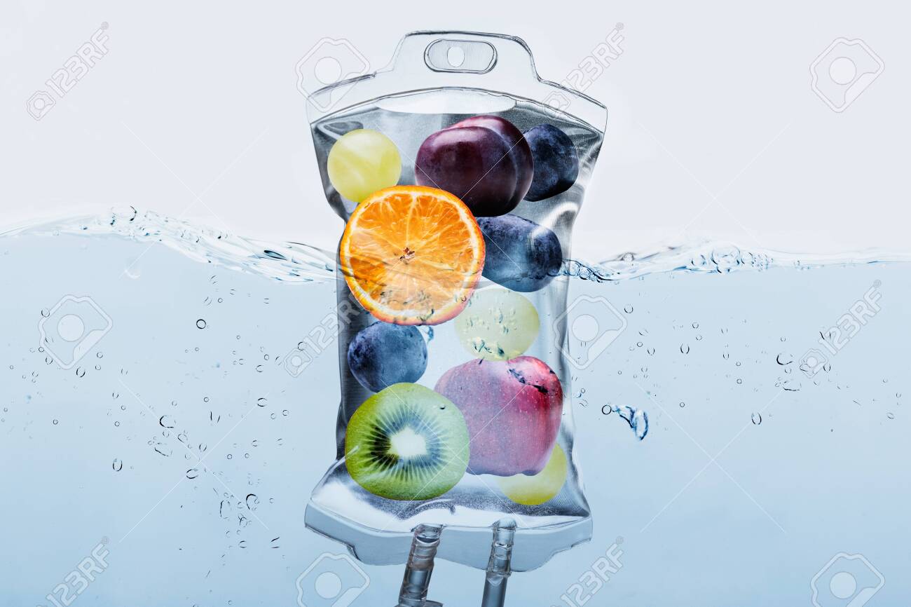 Close-up Of Various Fruit Slices In Saline Bag Dip In Water Against White Background - 133773223 Close-up Of Various Fruit Slices In Saline Bag Dip In Water Against White Background - 133773223