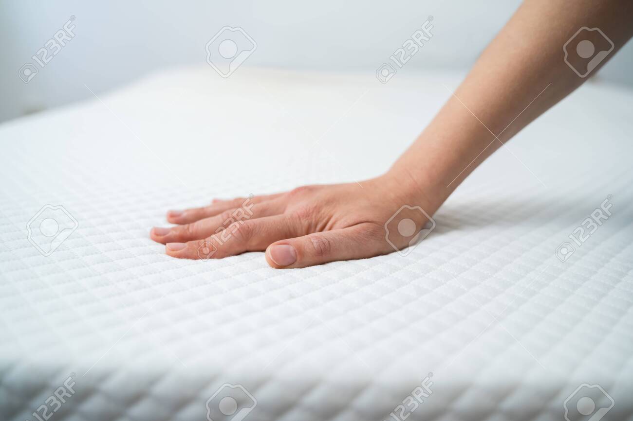 Hand Testing Orthopedic Memory Foam Core Mattress - 137275504 Hand Testing Orthopedic Memory Foam Core Mattress - 137275504
