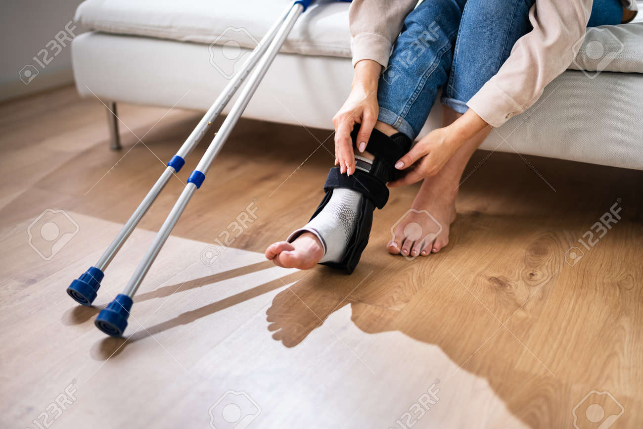 https://previews.123rf.com/images/andreypopov/andreypopov2204/andreypopov220400881/185062870-woman-with-leg-injury-using-crutches-at-home.jpg