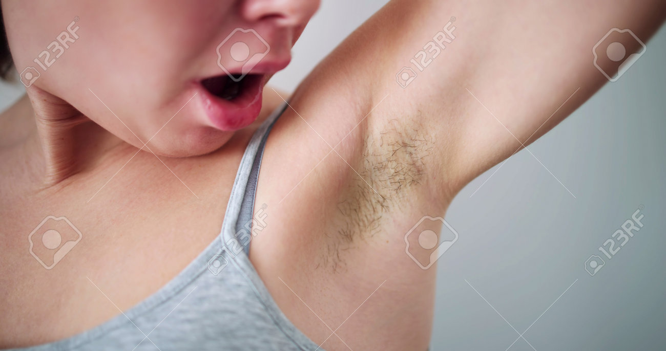 Young girl with armpit hair 