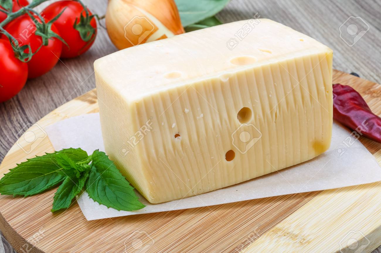 Download Yellow Cheese Brick With Mint Leaves On The Wood Background Stock Photo Picture And Royalty Free Image Image 43882432 Yellowimages Mockups