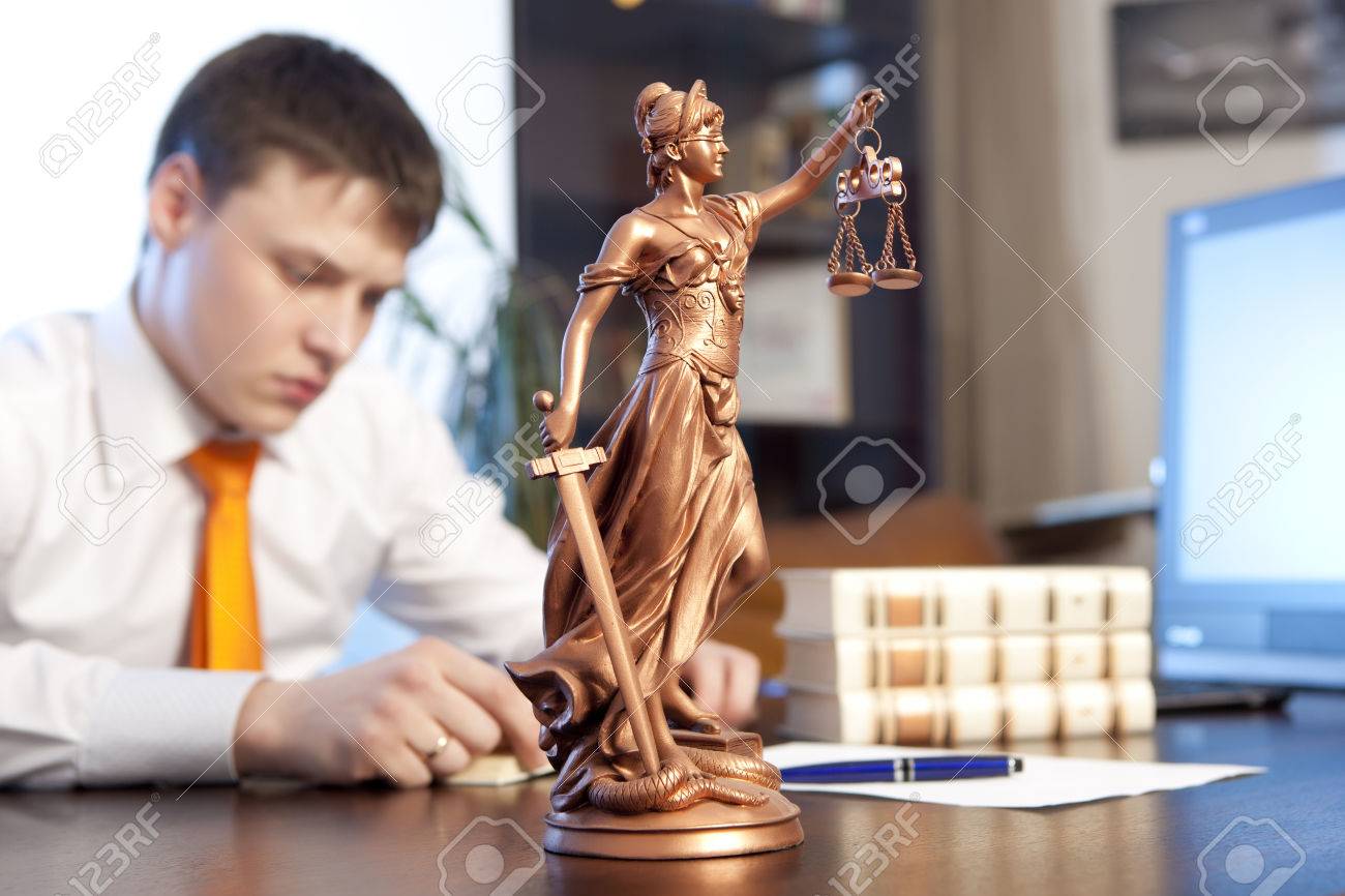 Lawyer reading a book in the office - 36331081 Lawyer reading a book in the office - 36331081