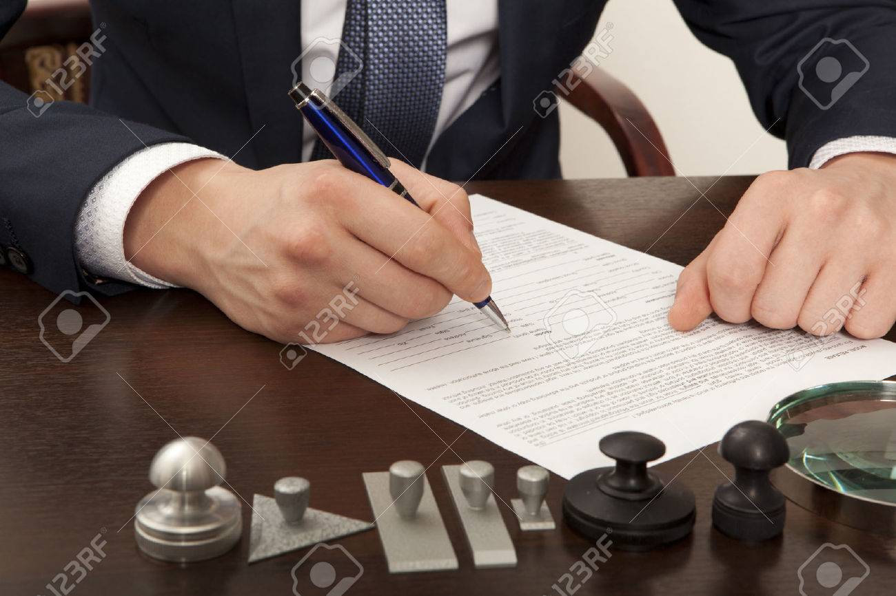 Lawyer, notary signs the documents from our office - 38258629 Lawyer, notary signs the documents from our office - 38258629