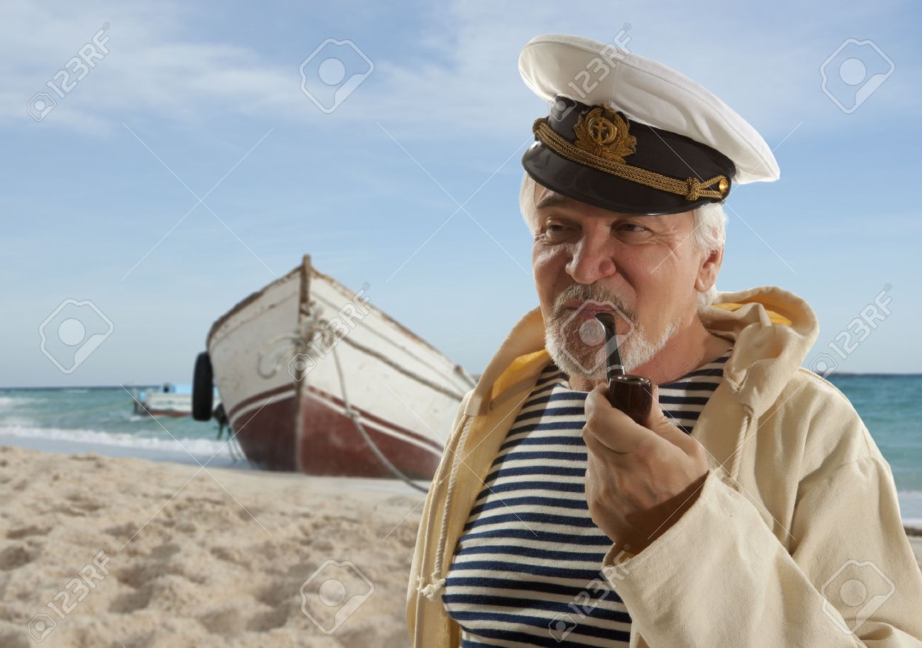 Captain. Sailor man in marina port with boats background - 45797672 Captain. Sailor man in marina port with boats background - 45797672