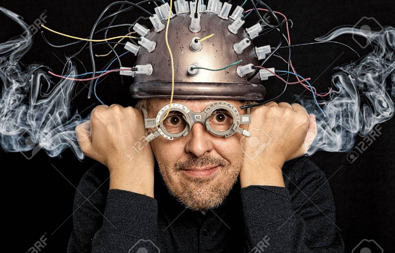 Crazy inventor with helmet for brain research - 52626005 Crazy inventor with helmet for brain research - 52626005