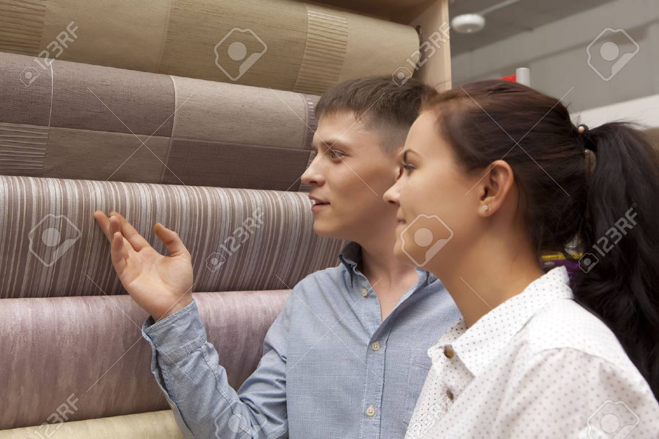 Happy family couple having fun in store choosing for buying wallpaper looking at design image - 59608265 Happy family couple having fun in store choosing for buying wallpaper looking at design image - 59608265