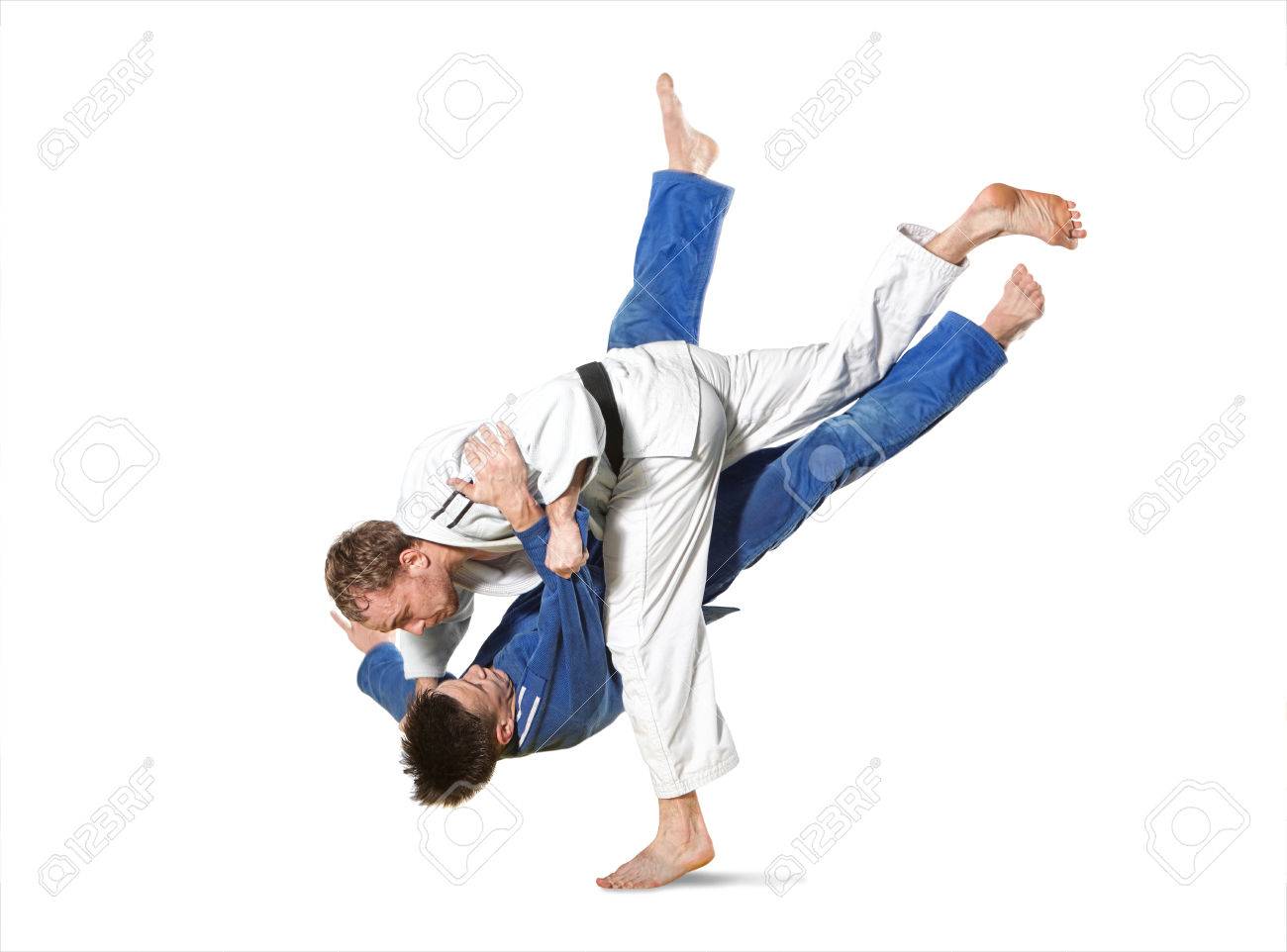 The two judokas fighters fighting men on white background - 69347616 The two judokas fighters fighting men on white background - 69347616