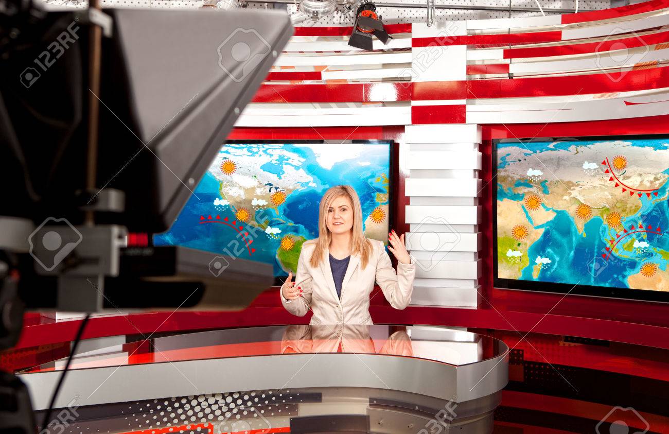Weather forecast. A television anchorwoman at studio during live broadcasting - 78457780 Weather forecast. A television anchorwoman at studio during live broadcasting - 78457780