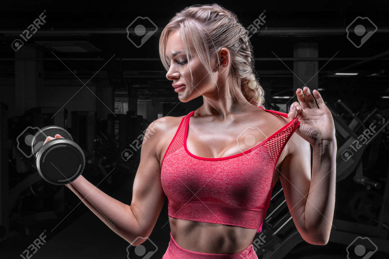Busty Blonde In A Pink Tracksuit Posing