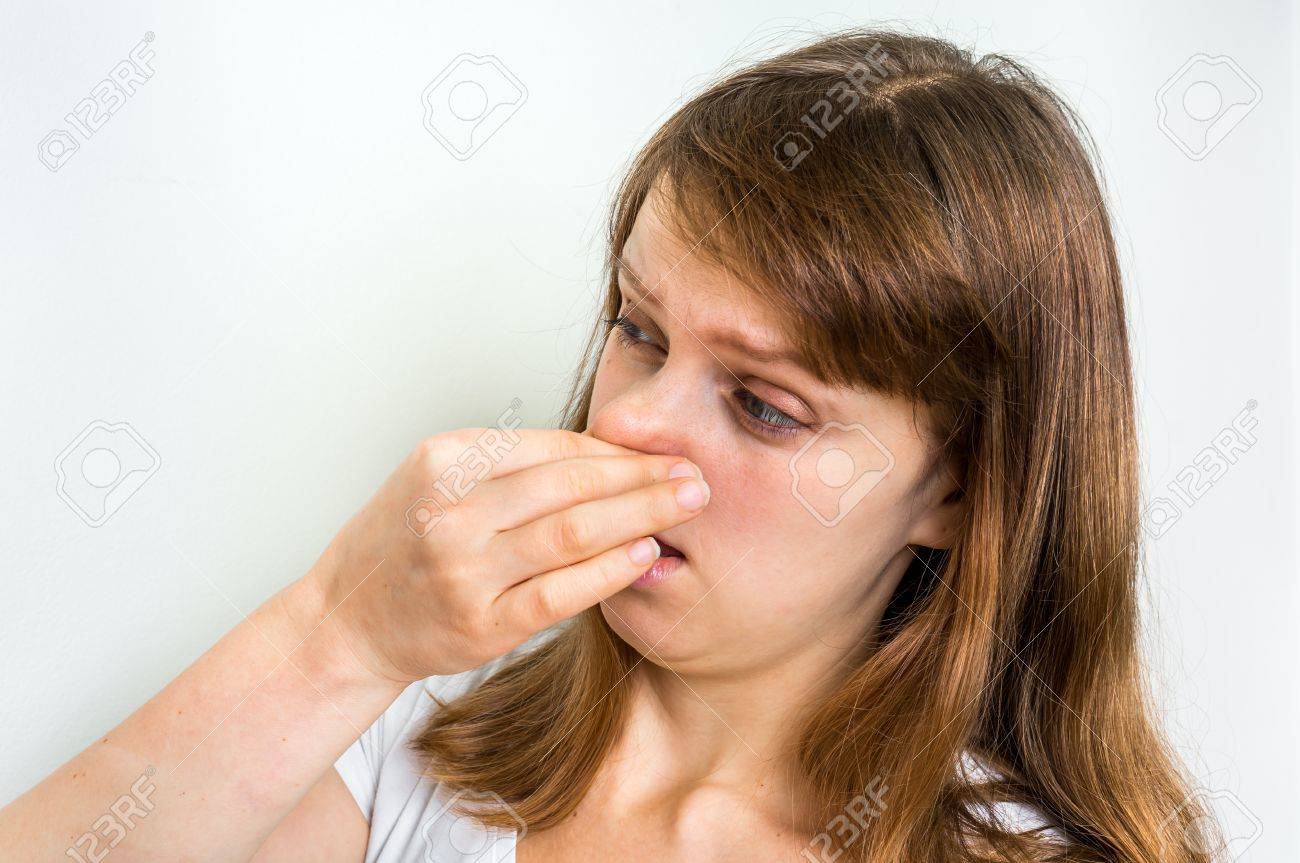 Young Woman Holding Her Nose - Bad Smell Concept Stock Photo, Picture And Royalty Free Image. Image 74581575. Young Woman Holding Her Nose - Bad Smell Concept Stock Photo, Picture And Royalty Free Image. Image 74581575.