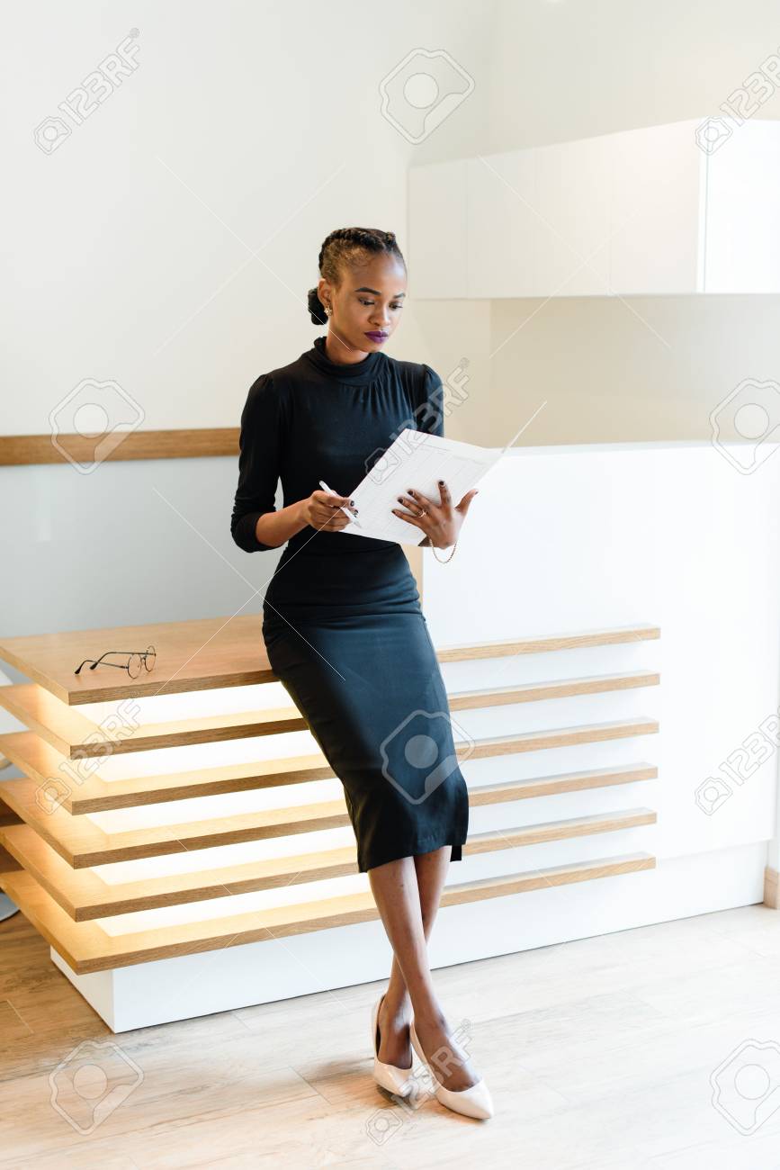 black dress beige shoes