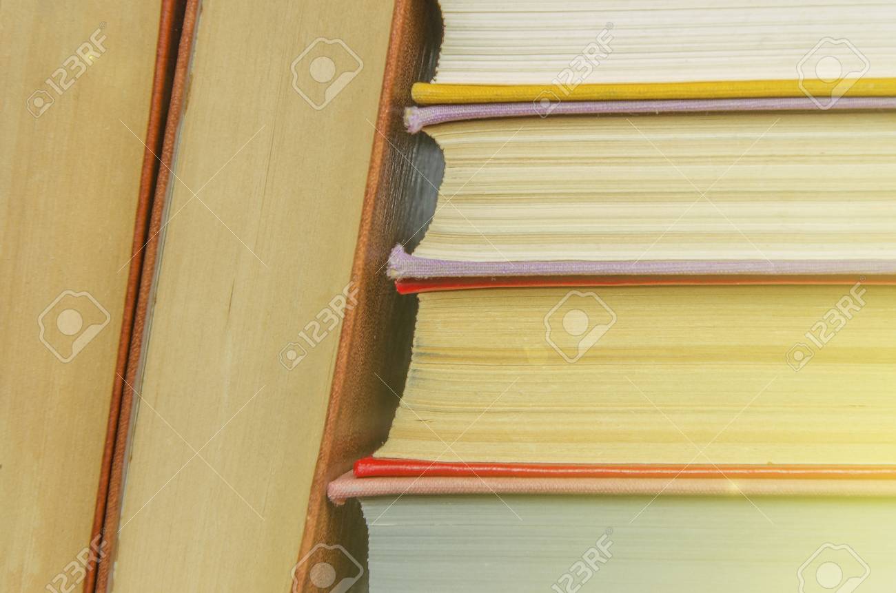 stack of books different colors education background back to